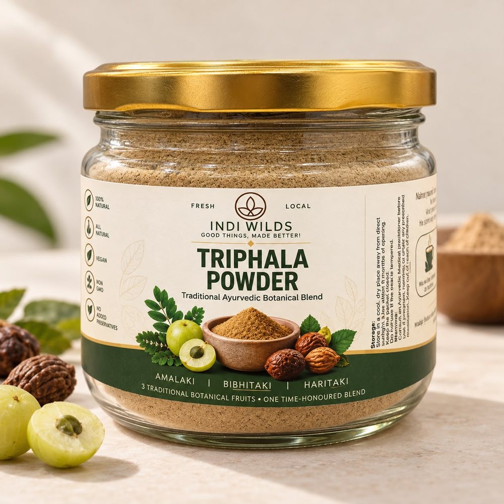 Jar of Indiwilds Triphala Powder with its ingredients shown on the label